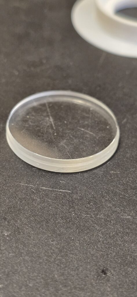 Old watch crystal with visible scratches